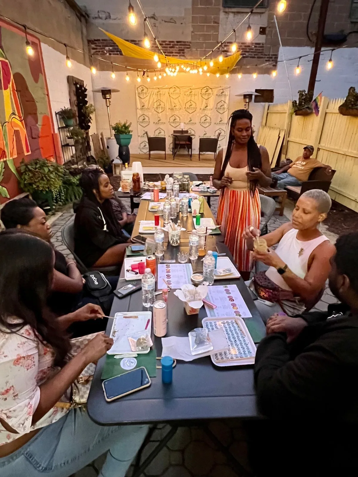 A community education gathering with people seated around a table